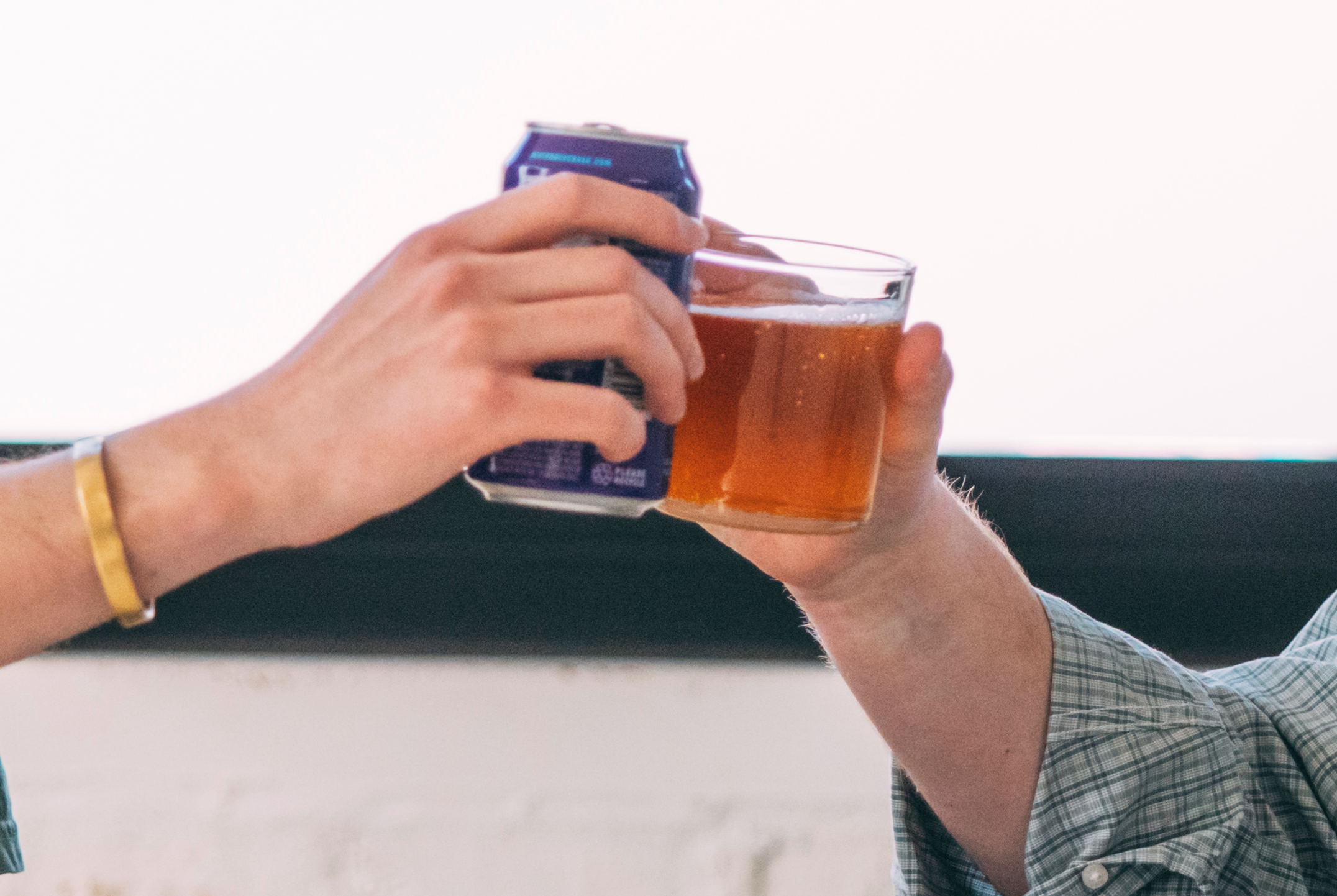 A hemp beverage and a beer mid-cheers
